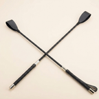 Riding crop black studio product shot