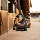 Aluminium safety stirrup with rider boot on footbed