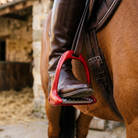 Aluminium safety stirrup on a saddle close-up