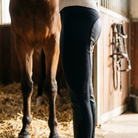 Rider wearing stretch leather riding leggings close-up